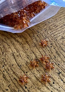 Small Amber Plastic Star Beads - Picture 1 of 3