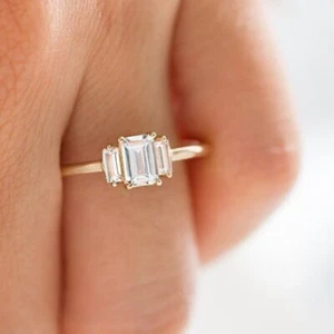 2.3ct Emerald Simulated Diamond Classic Trilogy Engage Ring Yellow Gold Plated - Picture 1 of 5