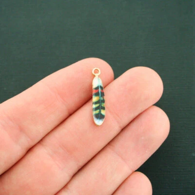 4 dijes de plumas tono dorado esmalte rojo y amarillo - E602 Foto 1 de 2