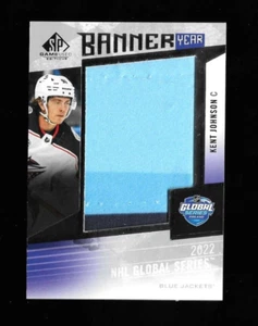 Kent Johnson 2023-24 SP Spiel gebraucht BANNER JAHR NHL '22 GLOBAL SERIES JUMBO Swatch - Bild 1 von 2