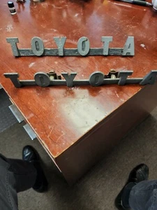 69 - 74 TOYOTA LAND CRUISER FJ40 FJ42 FRONT GRILLE TOYOTA EMBLEM BADGE OEM NEW - Picture 1 of 7