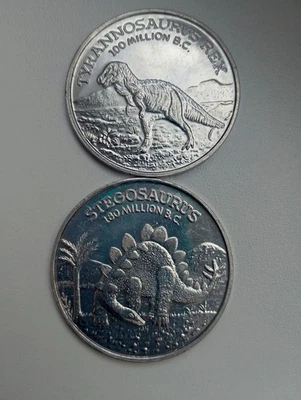 Stegosaurus Tyrannosaurus Rex Age of The Dinosaur 1988 Tokens Lot Jurassic Park - Bild 1 von 2