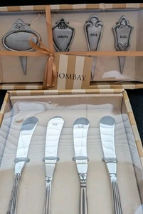 4 marcadores de queso Bombay y 4 esparcidores de cuchillos charcutería. Aluminio pulido. Ne - Imagen 1 de 13