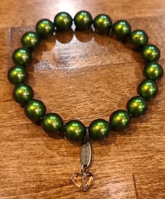 Pulsera elástica Sabika verde nacarada con cuentas firmada  Foto 1 de 3