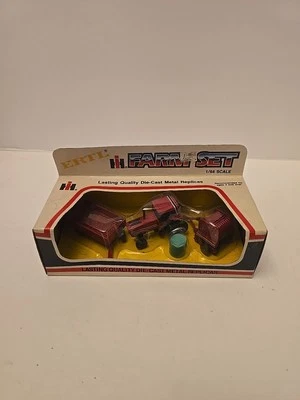 Ertl Die-cast International Farm Set 1:64 #1860 Tractor - Baler - Wagon - Image 1 of 4