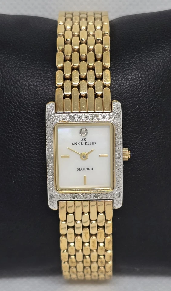 Reloj de cuarzo para mujer Anne Klein diamante tono dorado esfera mop correa 09 Foto 1 de 4