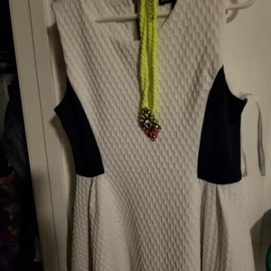 Navy blue and white dress with decorative neon green necklace. One stud missing - Picture 1 of 3