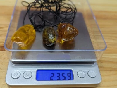 Amber Pendant On A Thread 3 Pieces 23.59 Grams - Image 1 of 4