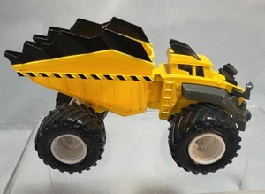 Spin Master Monster Jam Dirt Squad "AXEL", Dump Truck, Yellow - Foto 1 di 4