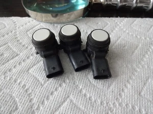 Sensor ultrasónico PDC parachoques estacionamiento serie BMW F30 3x OEM 9261587/104 blanco - Imagen 1 de 3