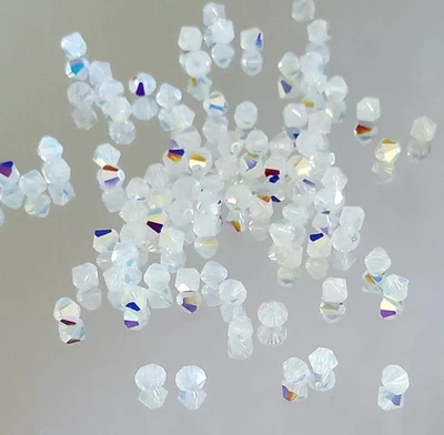 Cuentas bicónicas Swarovski 5301 4 mm, ópalo blanco AB (48 piezas) Foto 1 de 3