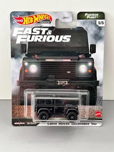 RUOTE CALDE FAST AND FURIOUS LAND ROVER DEFENDER 90 NERO 1:64 PREMIUM REAL RIDER - Foto 1 di 1