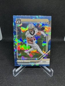 2024 Panini Donruss Optic Chris Olave Blue Ice Prizm /15 #141 New Orleans Saints - Foto 1 di 2