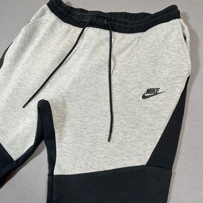 Pantalones deportivos Nike Tech polar para hombre talla L gris negro bolsillo con cremallera 805162-015 Foto 1 de 4