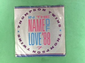 THOMPSON TWINS, IN THE NAME OF LOVE '88, 7" VINYL SINGLE, 1988, ARISTA, - Picture 1 of 4