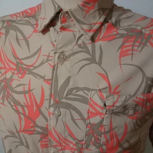 Polo uomo Under Armour grande Dockside UPF 30 stampa tropicale beige arancione - Foto 1 di 6