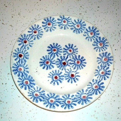 Plato de salpicaduras de diseño temprano escaso "margarita con punto central" de gres Foto 1 de 2