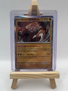Prismatic Evolutions Bloodmoon Ursaluna 054/131 Holo Rare Pokemon - Afbeelding 1 van 14