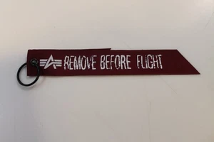 Alpha Industries RBF REMOVE BEFORE FLIGHT Jacken Anhänger rot mit schwarzem Ring - Bild 1 von 2