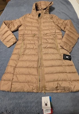 Новый с ярлыками Spyder женщин длинный стеганый пальто, красивый золотой бежевый цвет, размер M - Изображение 1 из 4