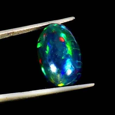 Peine de miel natural fuego azul etíope ópalo negro ovalado ópalo de piedras preciosas 18x12x6 mm Foto 1 de 4