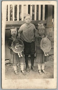 BROTHER & SISTERS w/ DOLLS ANTIQUE REAL PHOTO POSTCARD RPPC - Picture 1 of 2