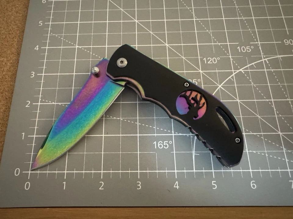 Cuchillo Plegable Cerrado Elk Ridge ER-A008 440C Arco Iris Titanio Camaleón Desvanecimiento 4.5" Foto 1 de 4