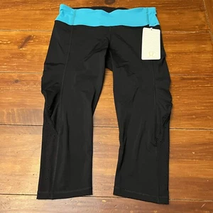 Lululemon Size 8 Water Bound Crop in Black With Teal Waistband - Picture 1 of 13
