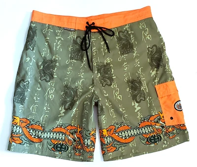 Bañador Maui And Sons Beach Boardshorts para hombre 38 dragones verde naranja forrado Foto 1 de 4
