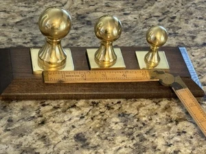 Set of 3 Brass Blank Stamps or Weights , on a Wooden Stand - Picture 1 of 1