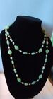Pale green Jade tone beaded necklace with gold tone beads on gold tone chain 44'
