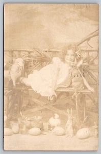 Postcard Easter Rabbit Studio Photo Bunnies Little Girl Lamp Egg Real Photo RPPC - Picture 1 of 2
