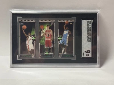 2003-04 Topps Rookie Matrix LeBron James/Kirk Hinrich/Carmelo Anthony SGC 9 - Image 1 of 3