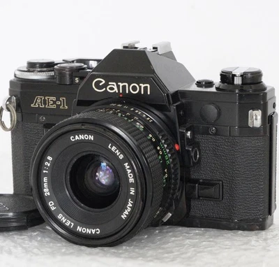 Canon AE-1 SLR Film Camera - Black + New FD 28mm F/2.8 Lens Meter Works Japan - Image 1 of 4