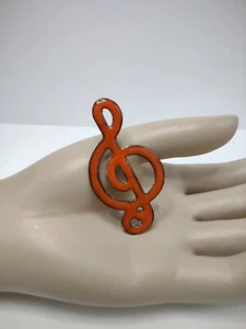 Broche prendedor vintage grande musical esmalte hendido sobre cobre diseño de tono naranja oscuro - Imagen 1 de 4