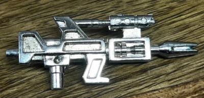 Accesorio de rifle de haz de partículas Topspin Jumpstartera G1 Transformers 1985 de colección Foto 1 de 2