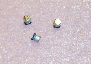 QTY (100) 10uf 25V 85' SMD ELECTROLYTIC CAPACITORS NACE100M25V5X5.5TR13 NIC - Picture 1 of 2