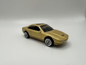 1/64 Scale BMW 850i E31 Diecast Sports Car - Hot Wheels 24107 Gold Metallic