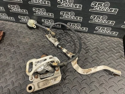 2003 02-15 RM85 RM 85 OEM Rear Brake Caliper Bracket Master Cylinder Hose Lever - Image 1 of 4