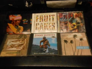 Jimmy Buffett 1990s CD Lot -6 Fruit Cakes Barometer Soup Beach House Banana Wind - Foto 1 di 10