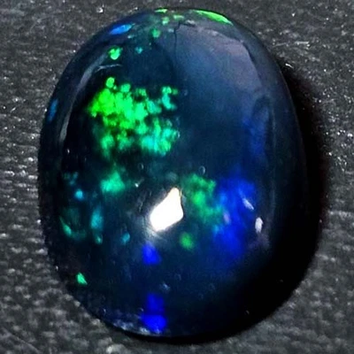 NATURAL AAA+GENUINE COLOR PLAY OVAL CABOCHAN  ETHIOPIAN WELO BLACK OPAL 1.20 CTS - Image 1 of 3