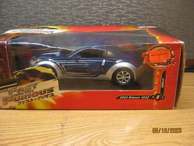 NISSAN 350Z ESCALA 1/18 EN AZUL POR JOYRIDE-(RC-2-ERTL) # 37460 Foto 1 de 4