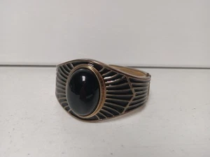 Brazalete de ónix negro con detalles dorados - Imagen 1 de 3