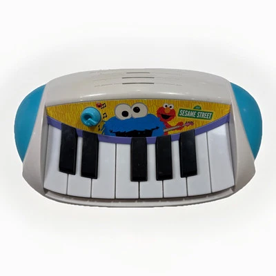 Teclado Hasbro Playskool Sesame Street Cookie Monster Let’s ROCK! Piano A B C Foto 1 de 4