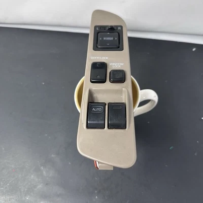 TOYOTA T100 1993-1998 INTERRUPTOR DE CONTROL DE VENTANA ELÉCTRICA MAESTRO IZQUIERDO MARRÓN (OEM) Foto 1 de 4
