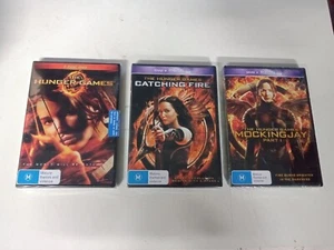 SET OF 3 HUNGER GAMES MOVIE DVDS. BRAND NEW AND SEALED. FREE POST TRACKING - Picture 1 of 2