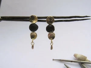 Gold earrings. 14K solid yellow gold earrings with one circle oxidized silver. - Picture 1 of 10