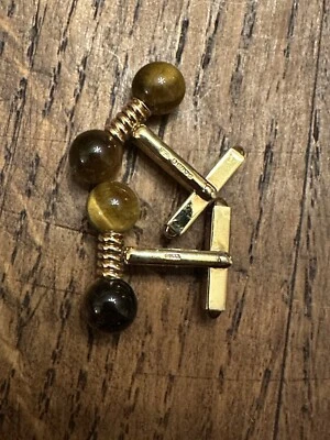 Gemelos Gucci vintage de oro de 9 quilates y ojo de tigre  Foto 1 de 4