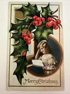 Vintage Merry Christmas Girl Reading Book By Window Postcard Embossed 1912 - Picture 1 of 2