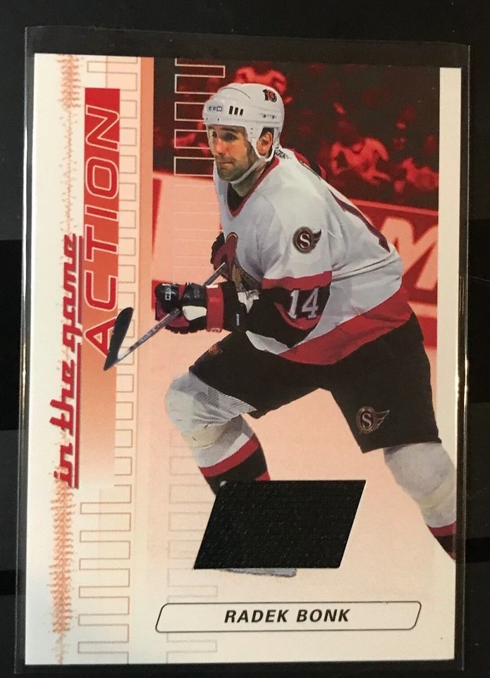 2003-04 In the Game Action Game-Used Jersey #M-7 Radek Bonk /500 - Image 1 of 1